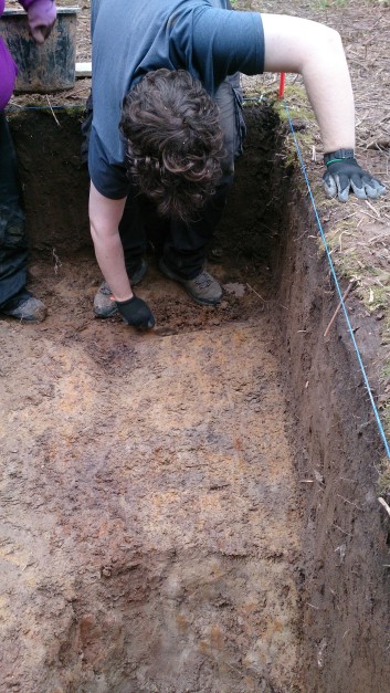 Jon excavating the fill of a potential cut preserved in the clay