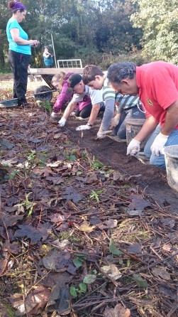 Our home-schoolers and their parents working through the topsoil.